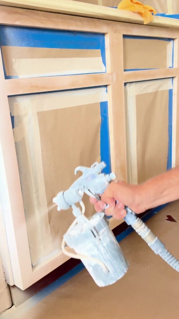 Spray application on masked cabinet frames