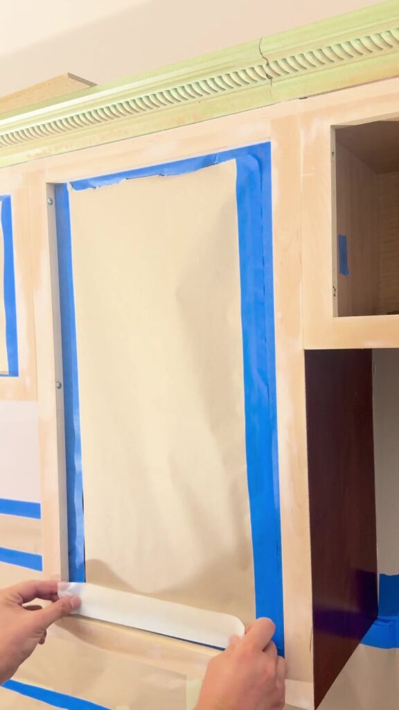 Cabinet openings protected with masking for coating work