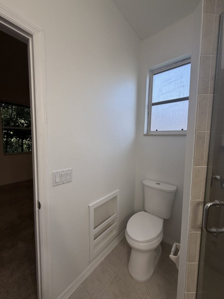 Residential bathroom walls and trim in a later documented condition