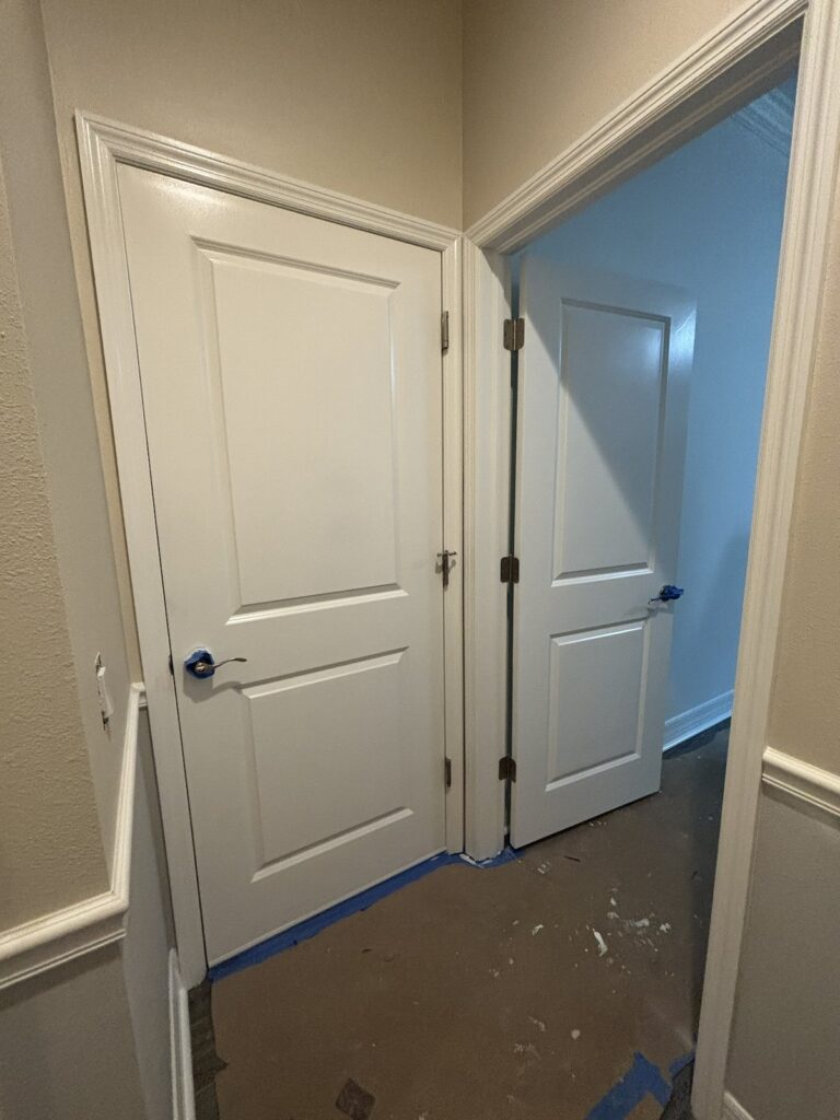 Residential interior door and trim during painting progress