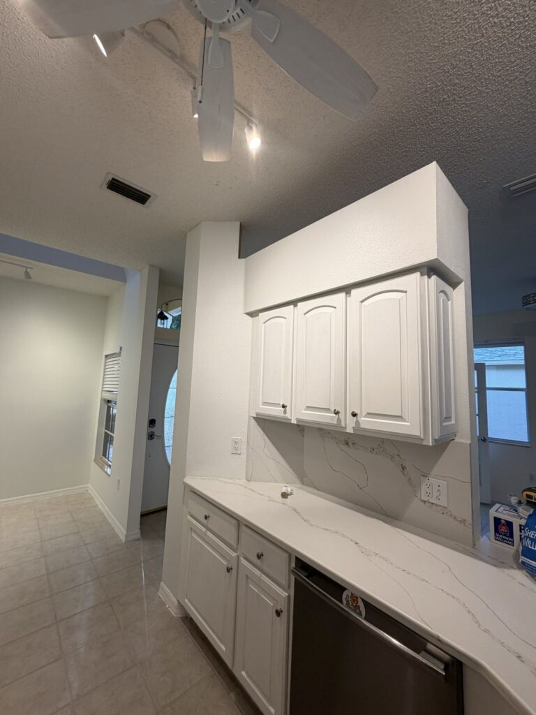 Kitchen cabinet wall and adjacent surfaces in a later documented interior condition