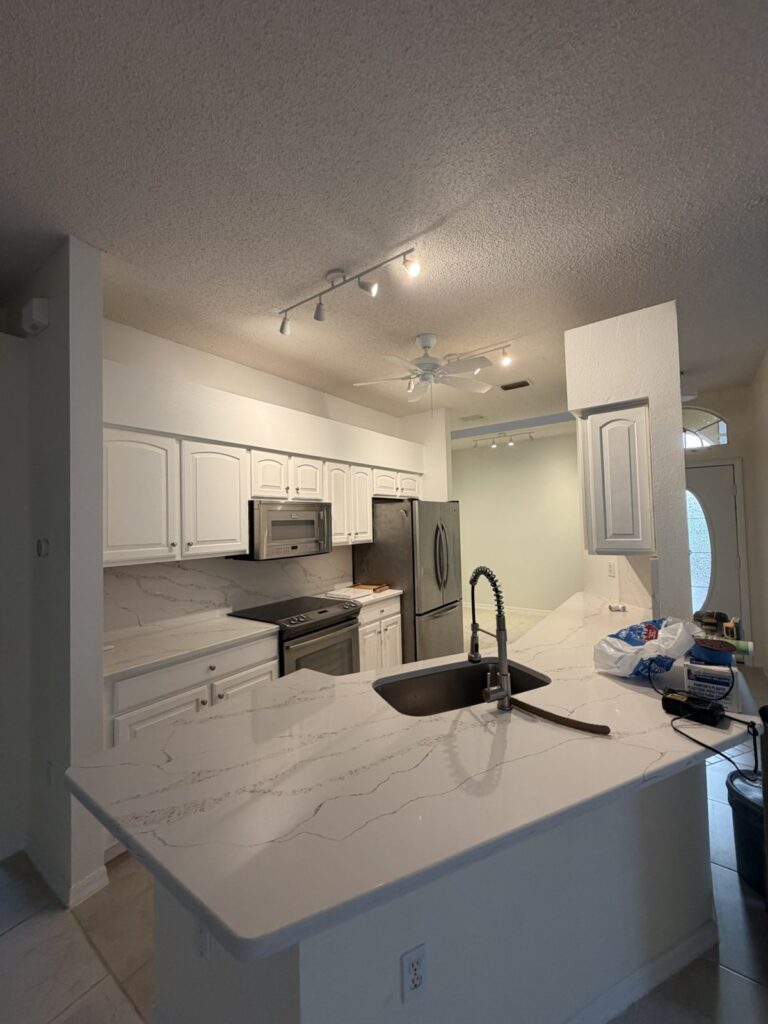 Residential kitchen overview in a later documented condition with tools still visible