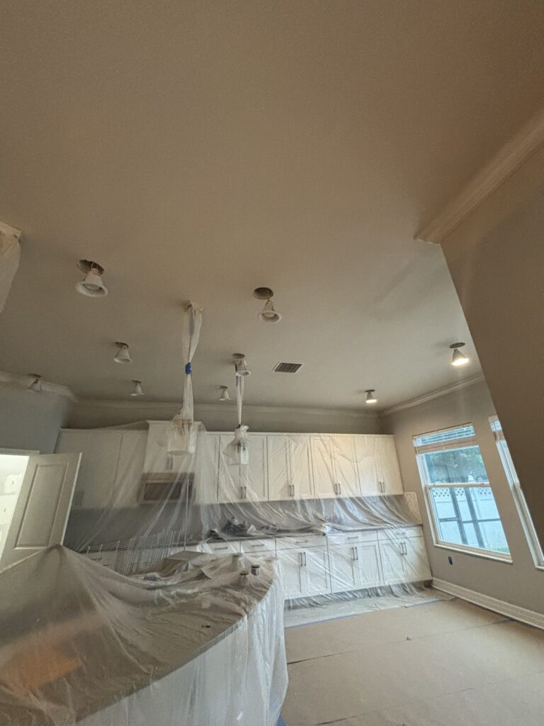 Protected residential kitchen during interior painting work