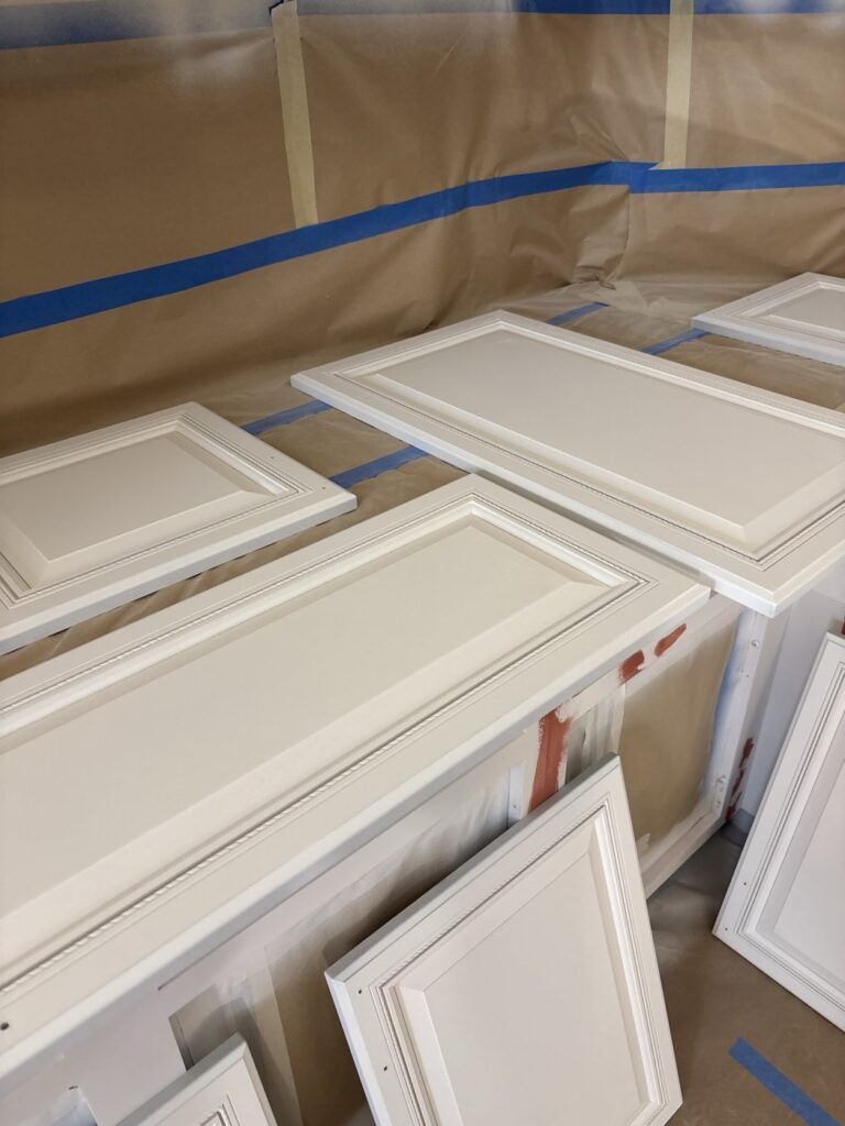 Cabinet doors arranged during the painting process