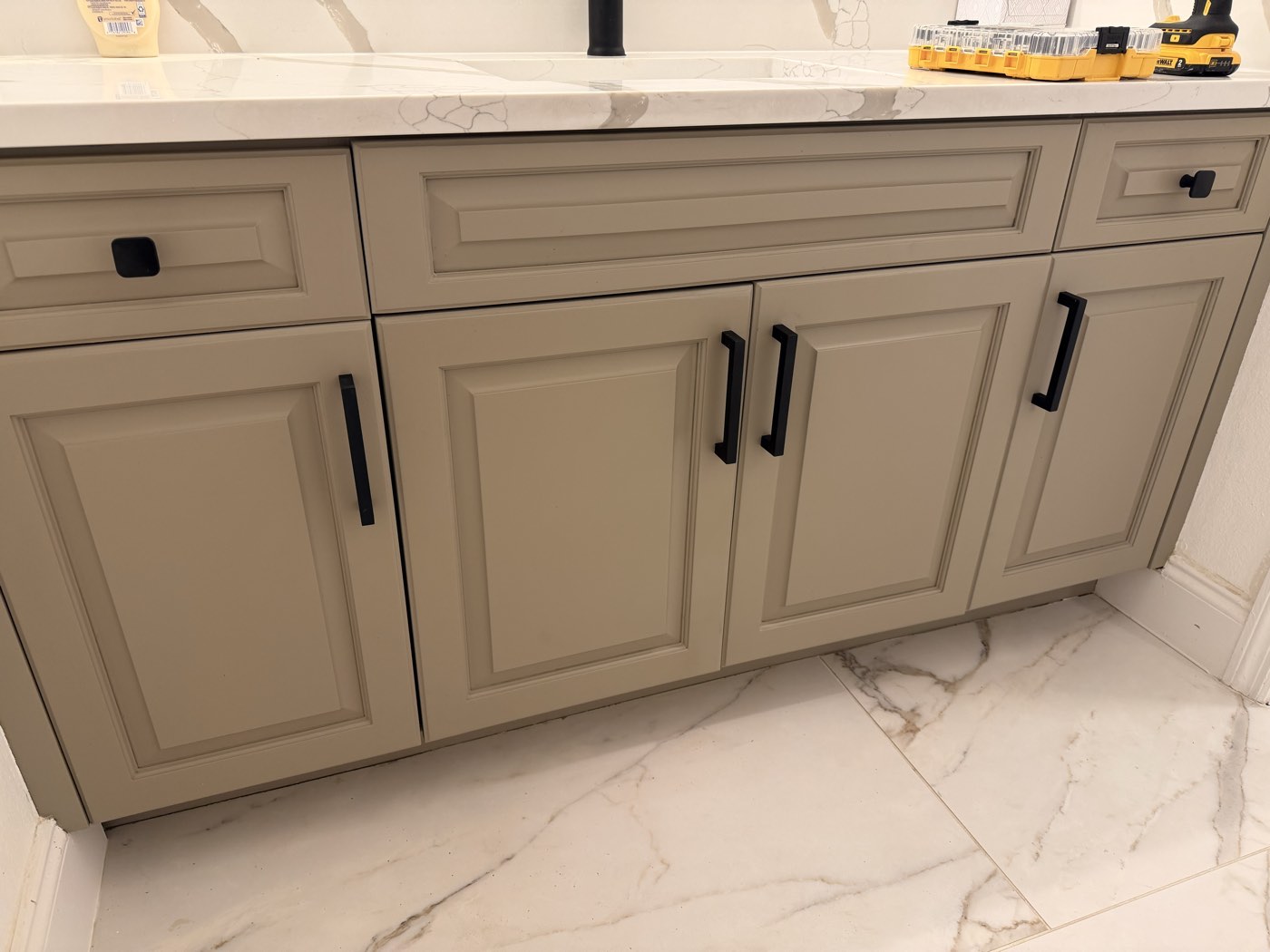 Painted bathroom vanity completed by Purple Painting