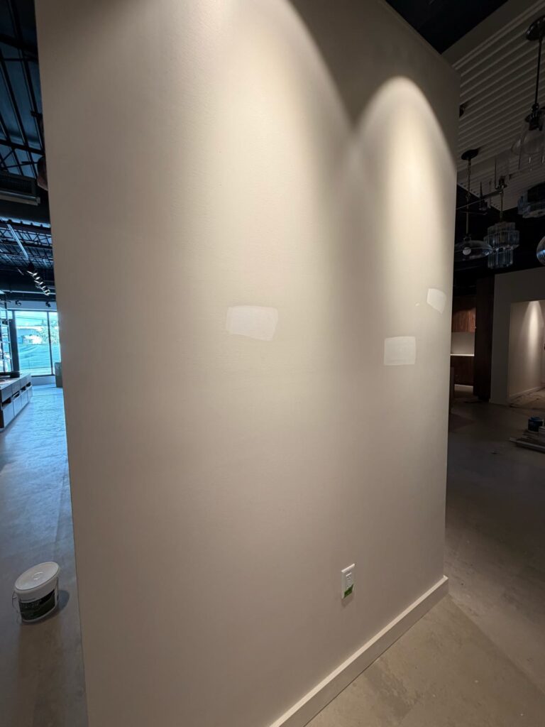 Sample areas visible on a commercial showroom wall