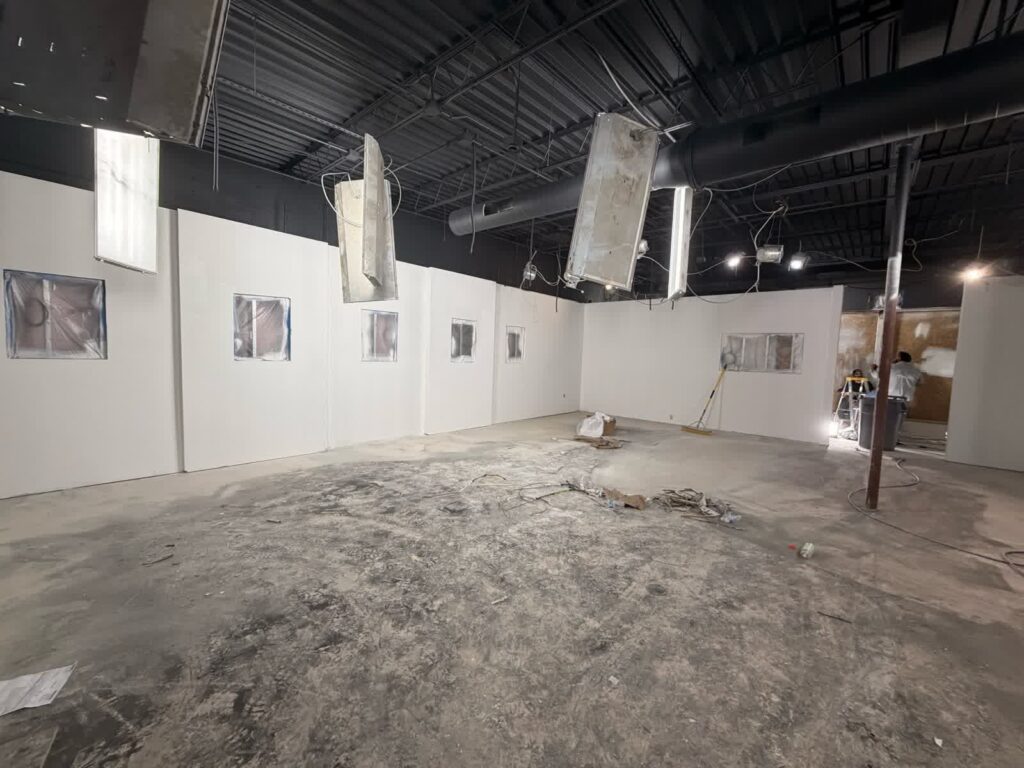 Commercial showroom walls during documented preparation