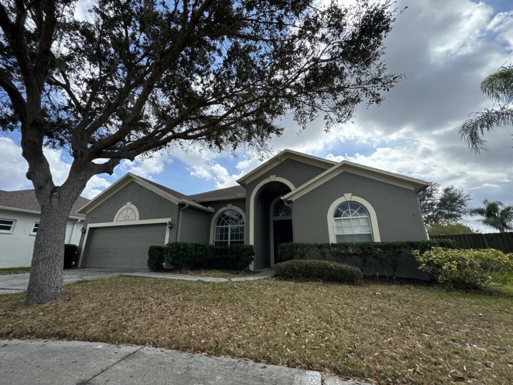 Completed Tampa Bay exterior painting project with arched windows