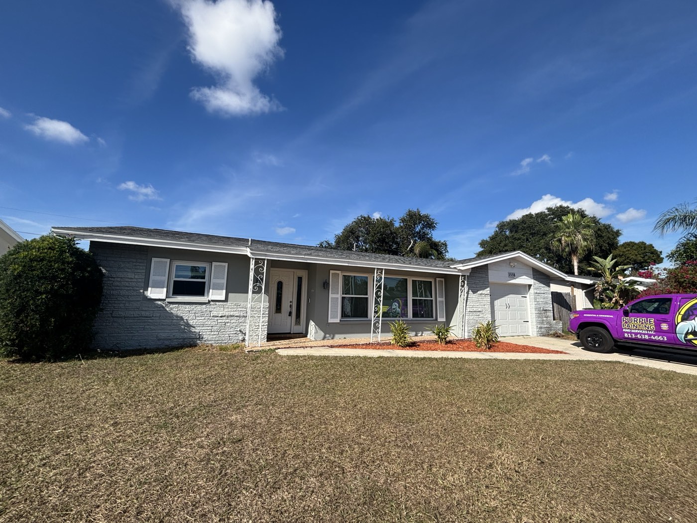 Before exterior repaint of a single-story Tampa Bay home