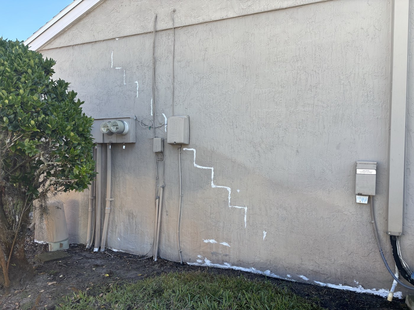 Stucco preparation in progress before exterior coating